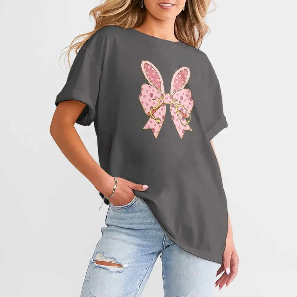 A Pink Bow Pattern With Bunny Ears And Pink Polka Dots, Hanging On A Golden Stethoscope And A Casual T-Shirt.