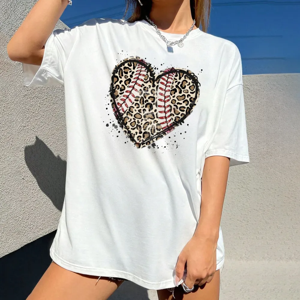 A Heart-Shaped Pattern With Baseball Stitching Elements Inside And Leopard Print, And Some Ink Splash Effects Around It, A Simple, Casual T-Shirt.