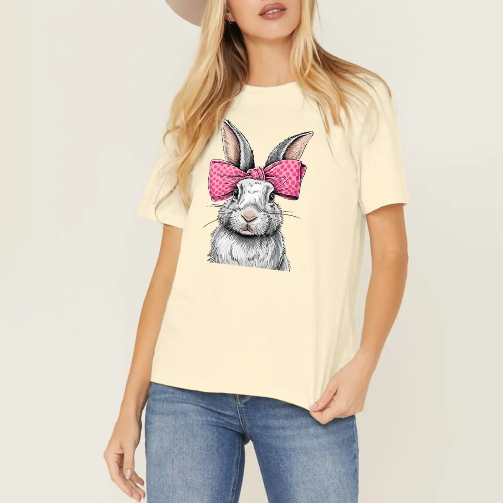 A Cartoon Rabbit With Ears Erected, Wearing A Pink Bow With White Polka Dots, Casual T-Shirt