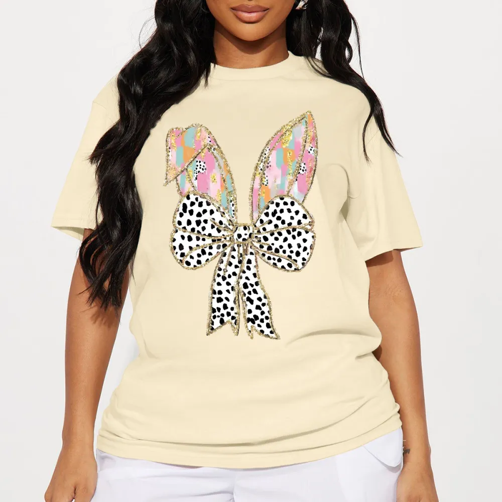 There Are Colorful Geometric Patterns On The Cartoon Rabbit Ears, With Gold Decorations On The Edges And A Big Bow With Black And White Spots, Which Is Lively And Cute, And A Casual T-Shirt.
