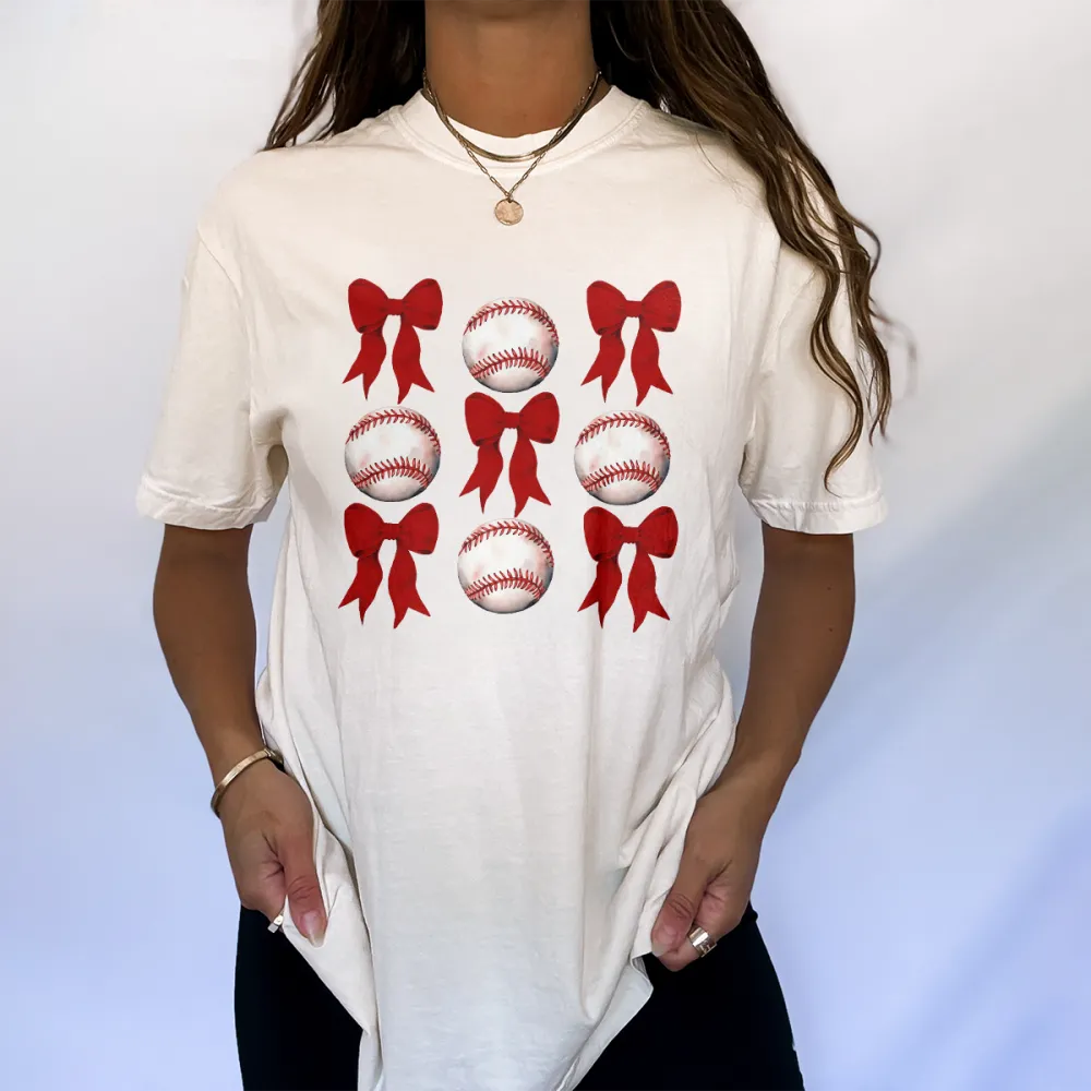 A Casual T-Shirt With Alternating Red Bow And Baseball Patterns.