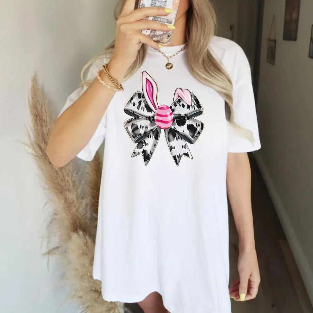 A Bow Pattern With Rabbit Ears, The Bow Is Black And White Stripes, And The Pink And White Striped Easter Egg Is Fashionable And Cute, Casual T-Shirt