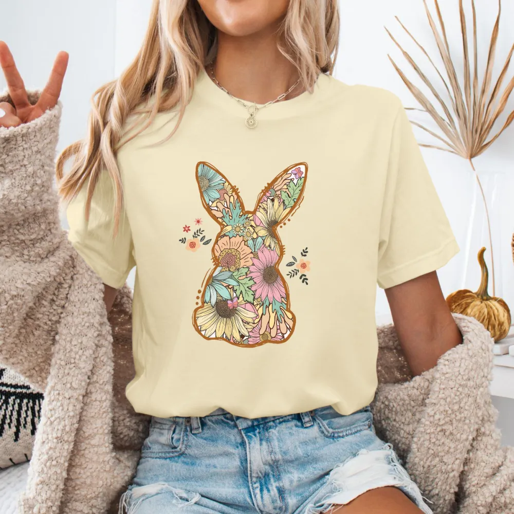 An Illustration Based On The Outline Of A Rabbit, With Floral Patterns Of Various Colors Filled In And Some Small Flowers And Leaves Dotted Around It, A Casual T-Shirt.