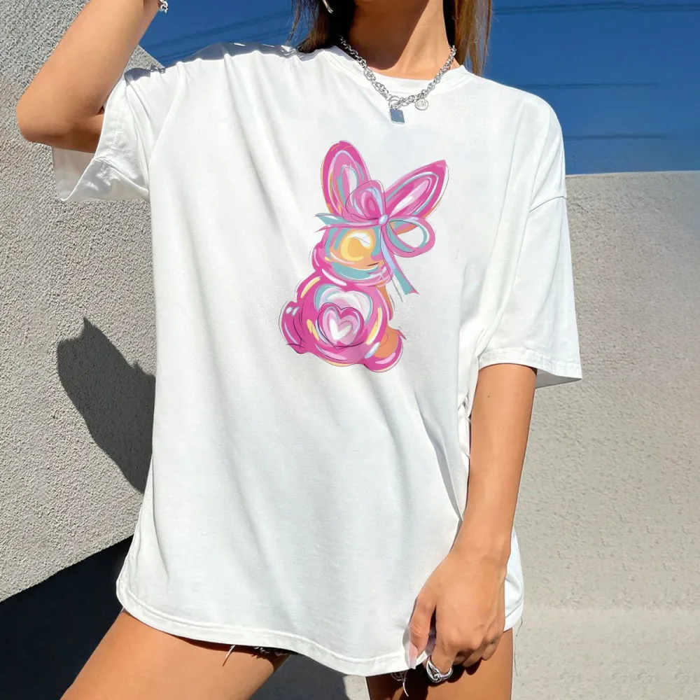 A Hand-Painted Rabbit Pattern With Pink As The Main Color, Matched With Blue, Yellow, Orange And Other Colors. The Rabbit Has Bow And Heart Elements On Its Body. It Is A Casual T-Shirt.