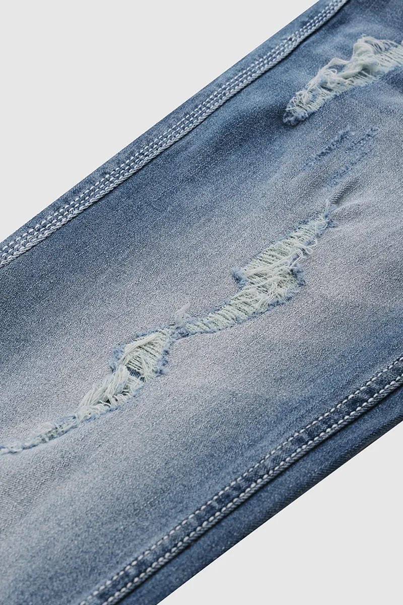 Cross Embroidery Studded Ripped Bootcut Jeans