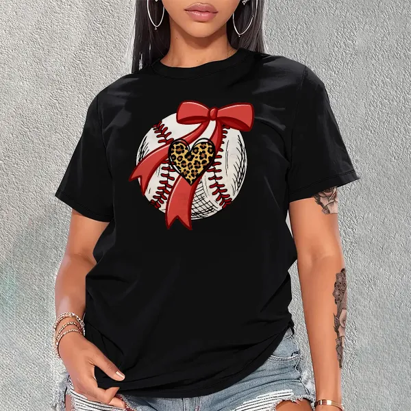 A Pattern Combining A Stitched Baseball, A Red Bow And A Leopard Print Heart. There Is Also A Leopard Print Heart Pattern On The Ball, A Casual T-Shirt.