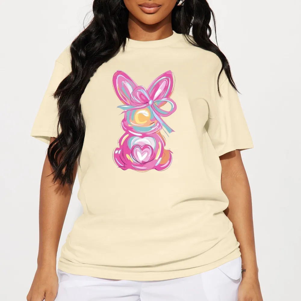 A Hand-Painted Rabbit Pattern With Pink As The Main Color, Matched With Blue, Yellow, Orange And Other Colors. The Rabbit Has Bow And Heart Elements On Its Body. It Is A Casual T-Shirt.