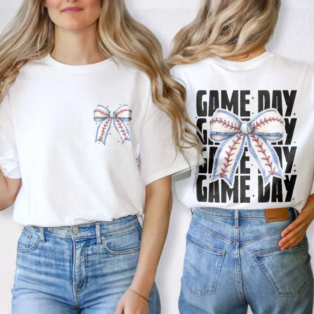 A Casual T-Shirt With Repeated Letters “GAME DAY” And A Bow Pattern In The Middle Designed In The Style Of Baseball Stitching.