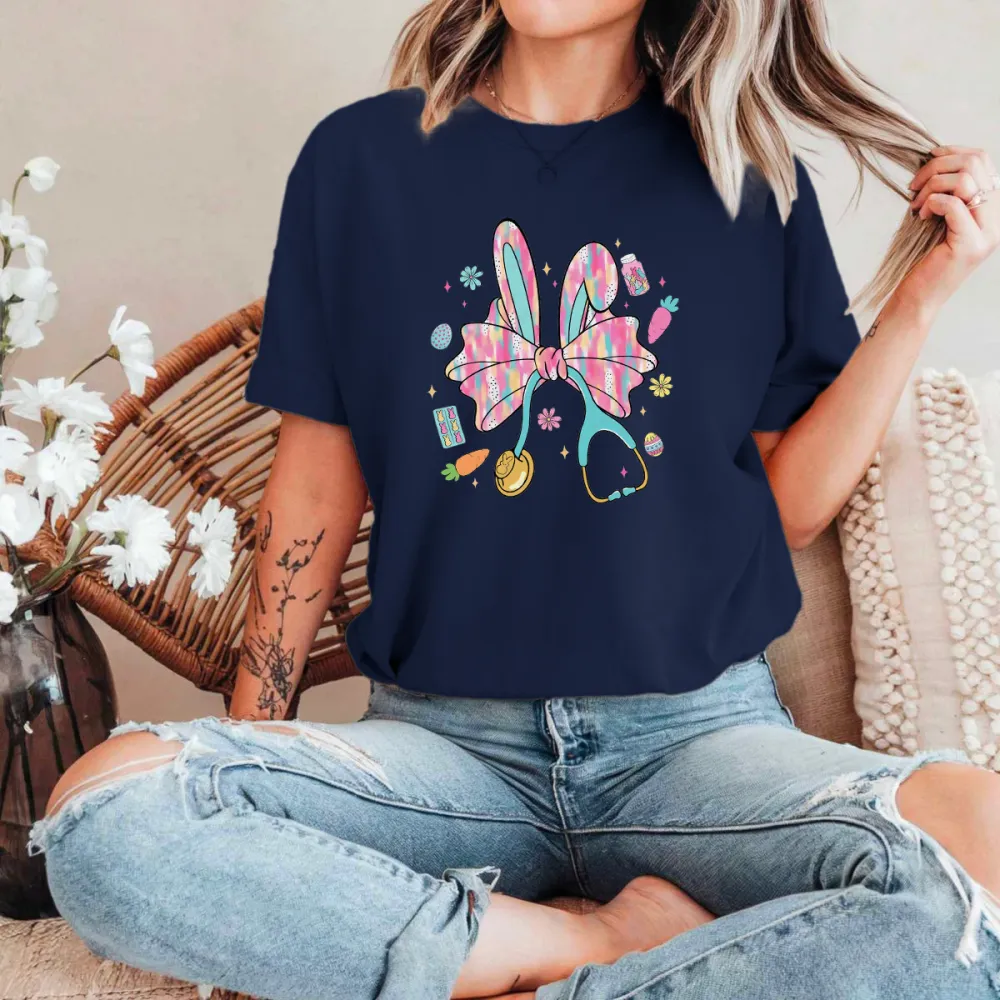 A Big Colorful Bow, Rabbit Ears, And Surrounded By Carrots, Easter Eggs, And Stethoscope Patterns. The Overall Style Is Lively And Casual T-Shirt.