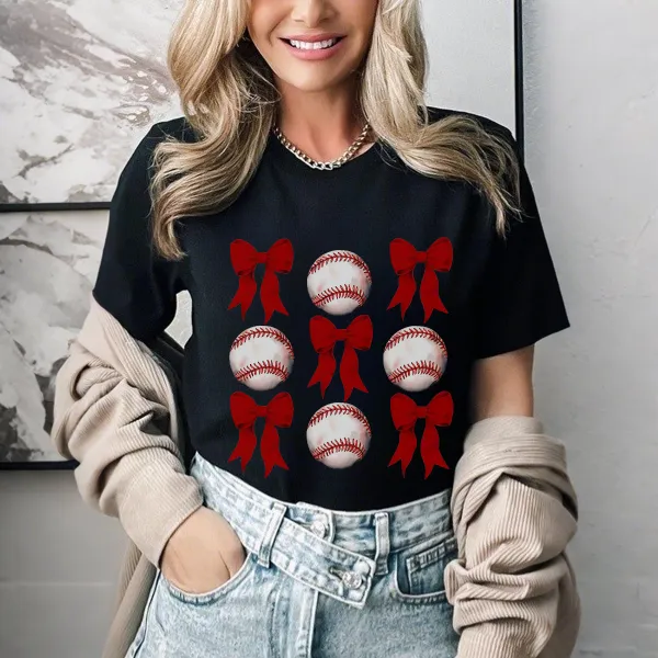 A Casual T-Shirt With Alternating Red Bow And Baseball Patterns.