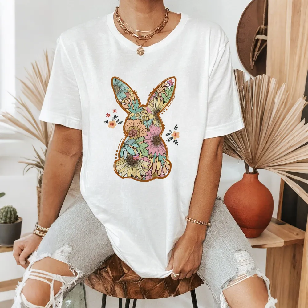 An Illustration Based On The Outline Of A Rabbit, With Floral Patterns Of Various Colors Filled In And Some Small Flowers And Leaves Dotted Around It, A Casual T-Shirt.
