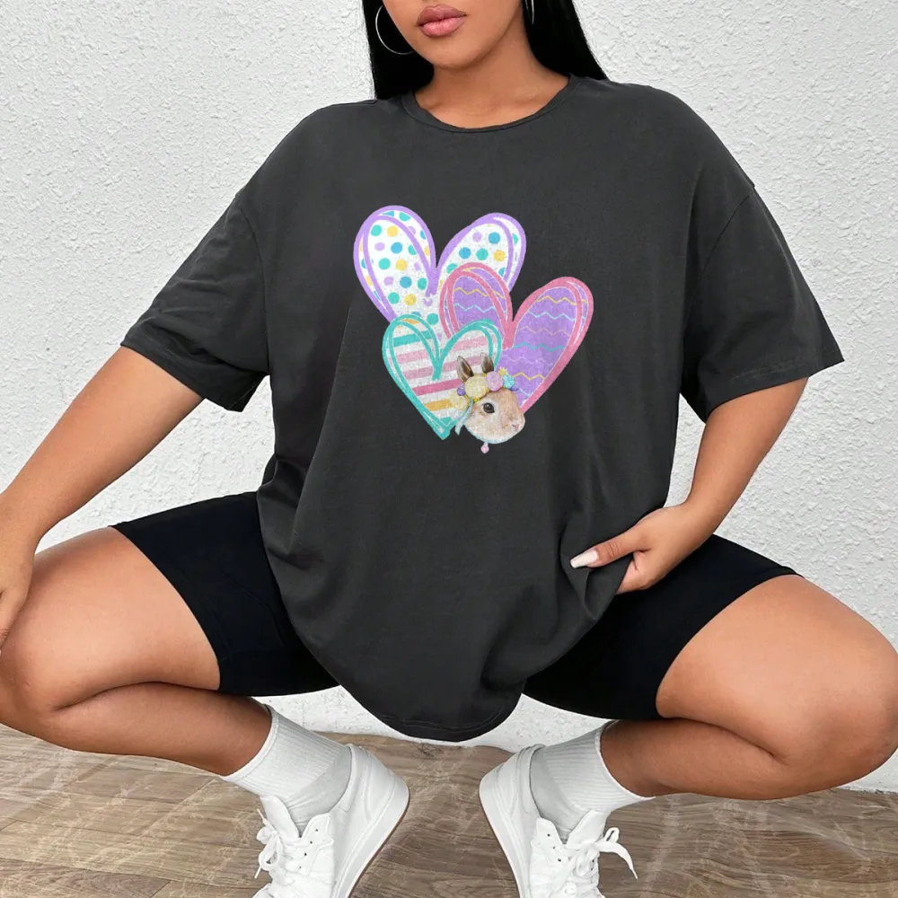 A Cute Little Rabbit, Surrounded By Several Decorative Heart-Shaped Patterns With Different Patterns Such As Polka Dots And Stripes, A Casual T-Shirt.