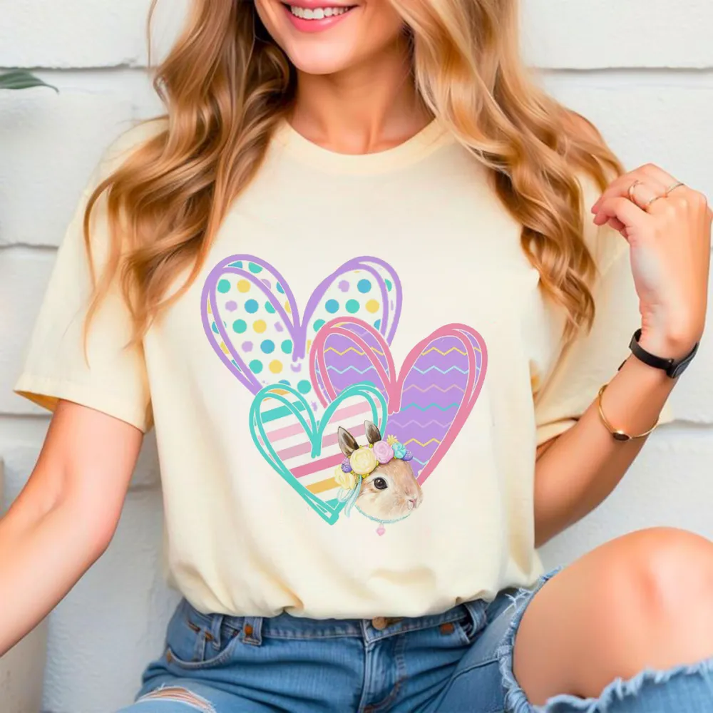 A Cute Little Rabbit, Surrounded By Several Decorative Heart-Shaped Patterns With Different Patterns Such As Polka Dots And Stripes, A Casual T-Shirt.